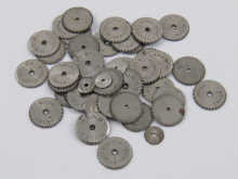 A quantity of steel watch winding wheels