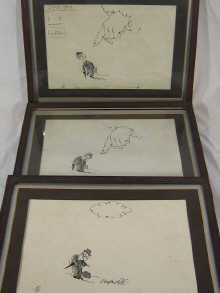Three framed original ink cartoon illustrations.