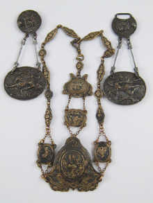 A gilt metal chatelaine with embossed
