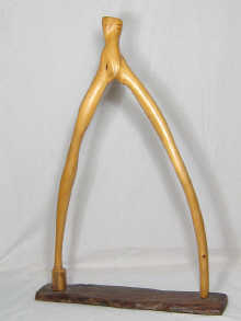 An abstract wood sculpture signed