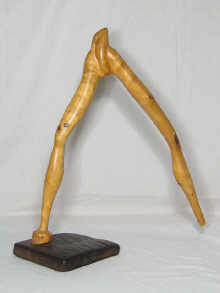 An abstract wood sculpture signed 14f2f5