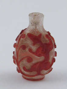 A clear glass Chinese snuff bottle with