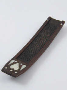 A treen nutmeg grater inlaid with