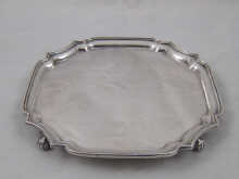 A rectangular silver salver with incurved