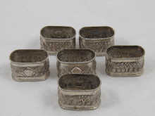 A set of six white metal (tests