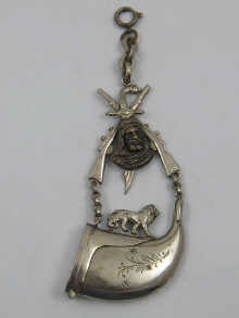 A white metal military fob with