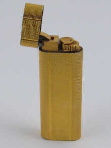 A gold plated Cartier lighter in