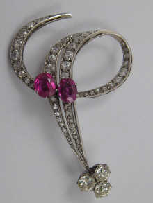 A fine diamond and ruby brooch