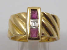 A ruby and baguette diamond ring