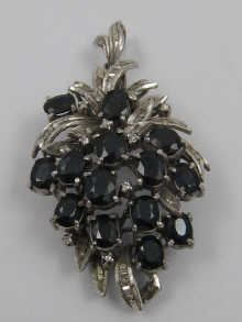 A diamond and sapphire pendant/