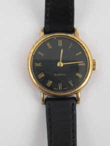 An 18ct gold ladys quartz wrist watch