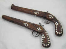 Two Middle Eastern percussion cap pistols