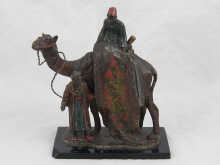 A cold painted metal group of two Arabian