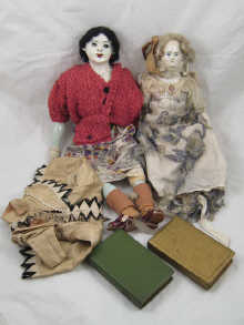 Two porcelain dolls with fabric bodies