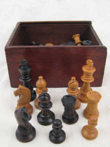 A boxwood chess set in box c. 1920