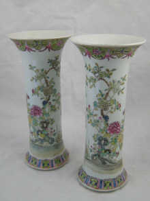 A pair of tall cylindrical Chinese 14f45e