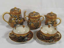 A Satsuma tea set comprising teapot