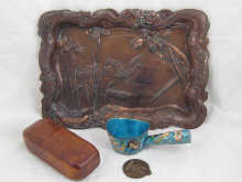 A copper coloured Japanese tray with