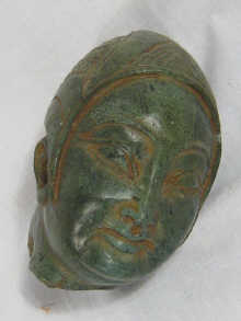 A finely carved green hardstone