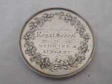 A silver medical medal from the Manchester