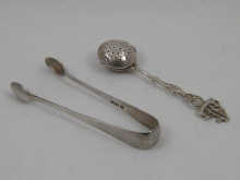 An .800 standard silver tea infuser