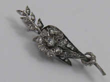 A diamond set floral brooch set 14f5a9