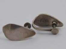 A pair of silver ear clips by George