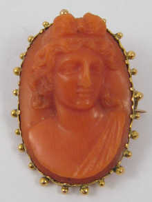 A 19th c. carved coral cameo brooch