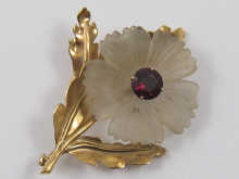 A hallmarked 9 carat gold brooch designed