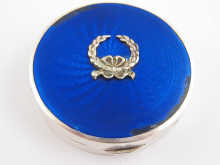 A silver box with blue guilloche enamel