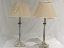 A pair of silver plated tall Corinthian