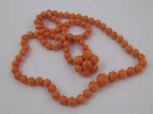 A graduated coral bead necklace