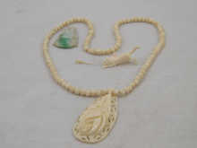 An ivory bead necklace with carved 14f6ee