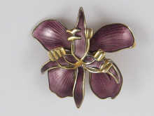 A silver gilt and purple enamel