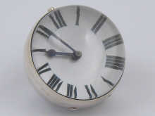 A white metal (tests silver) ball clock
