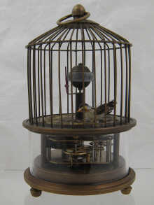 A birdcage novelty clock with visible 14f710