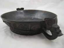 A Chinese circular bronze two handled