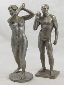 A pair of cast Soviet aluminium figures