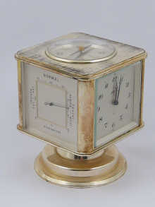 A combination clock/ barometer/