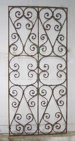 A Painted Wrought Iron Window Grill