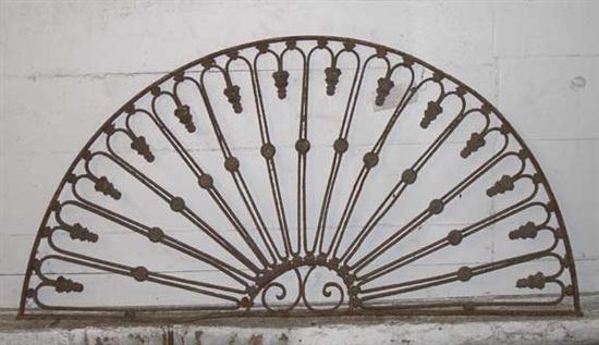 A Wrought Iron Arched Transom Grill