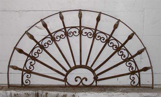 A Wrought Iron Arched Transom Grill