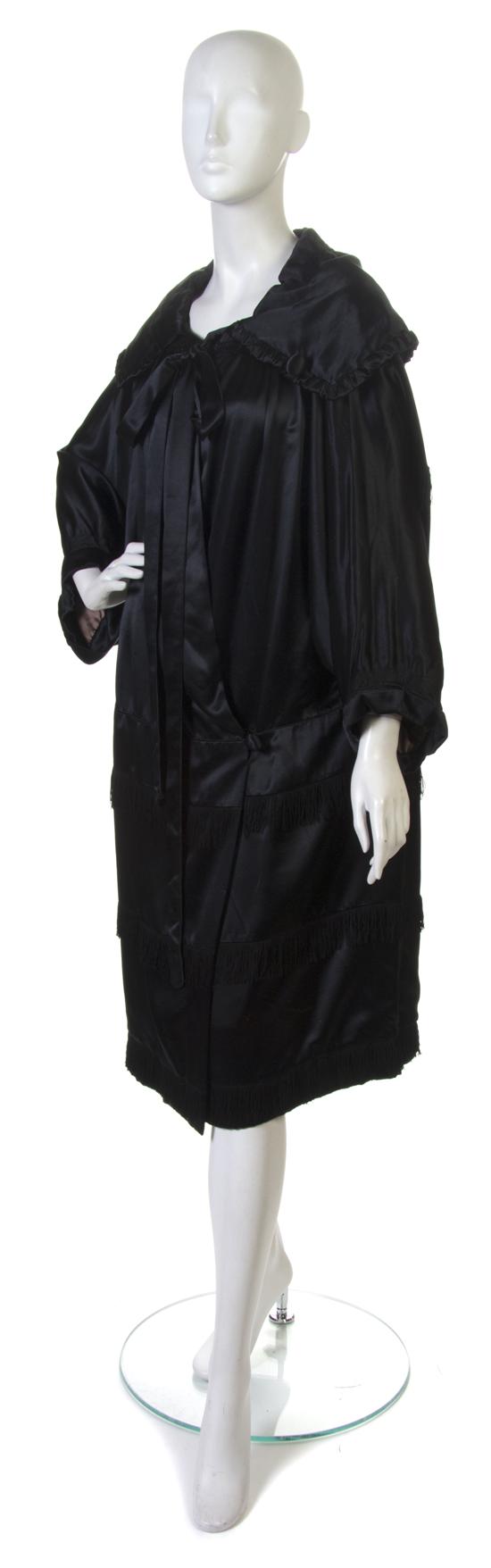 A Black Satin Evening Coat with fringe