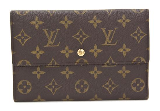 A Louis Vuitton Monogram Canvas Wallet.