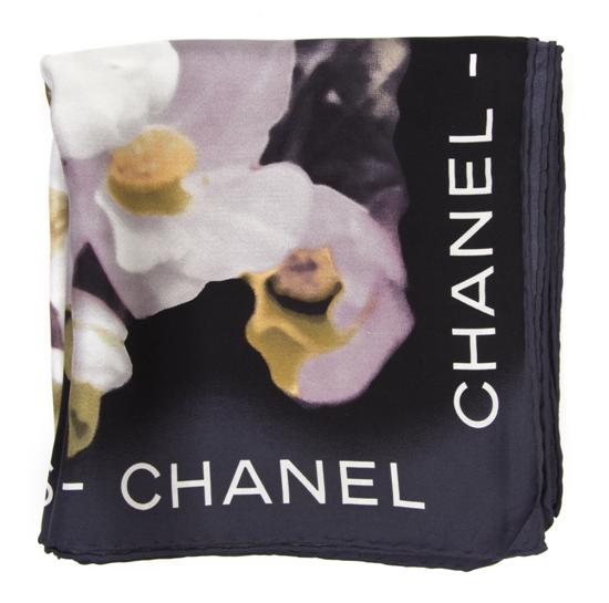 A Chanel Black Silk Scarf in a