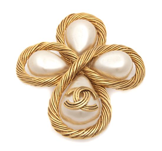 A Chanel Faux Pearl Brooch. Stamped:
