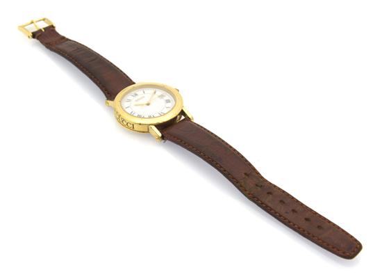 A Gucci Watch with brown leather