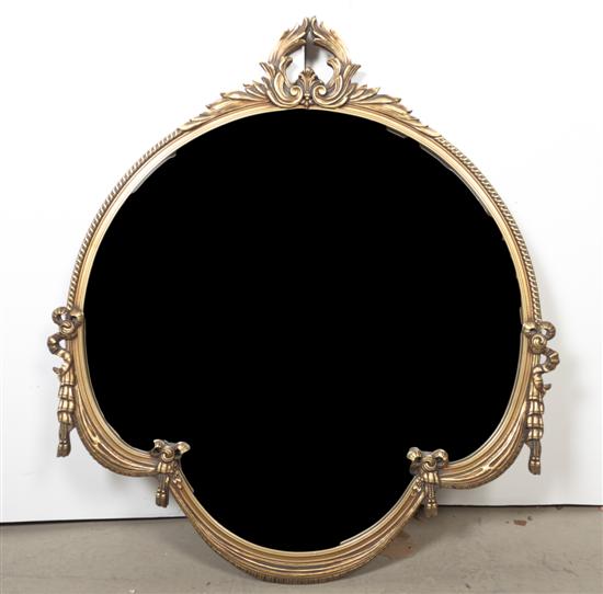 A Giltwood Mirror of shaped circular