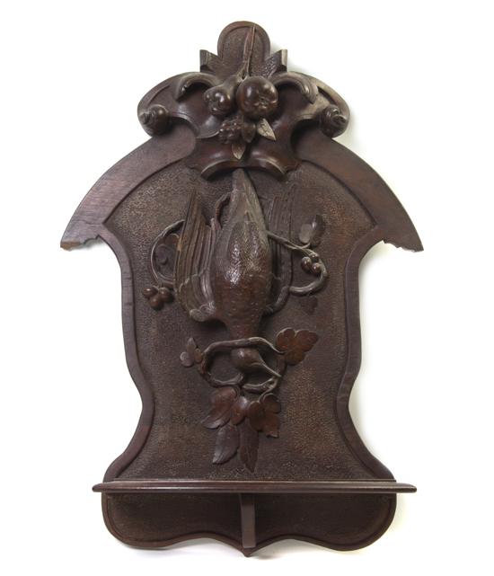 * A Black Forest Carved Wall Bracket