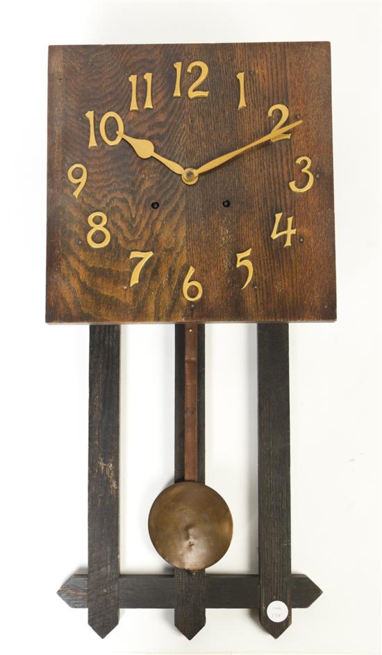 An Arts and Crafts Oak Wall Clock 15238a